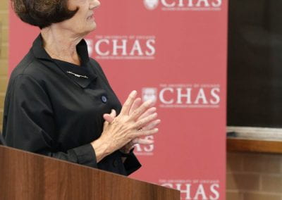 Jeanne Marsh standing at a podium at the 2019 CHAS Paris Conference