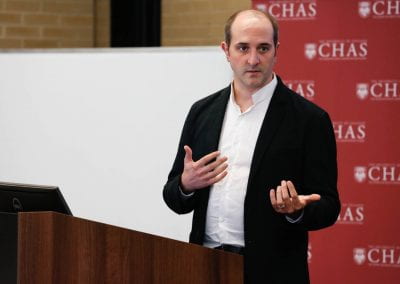 Attendee speaking to an audience at the 2019 CHAS Paris Conference